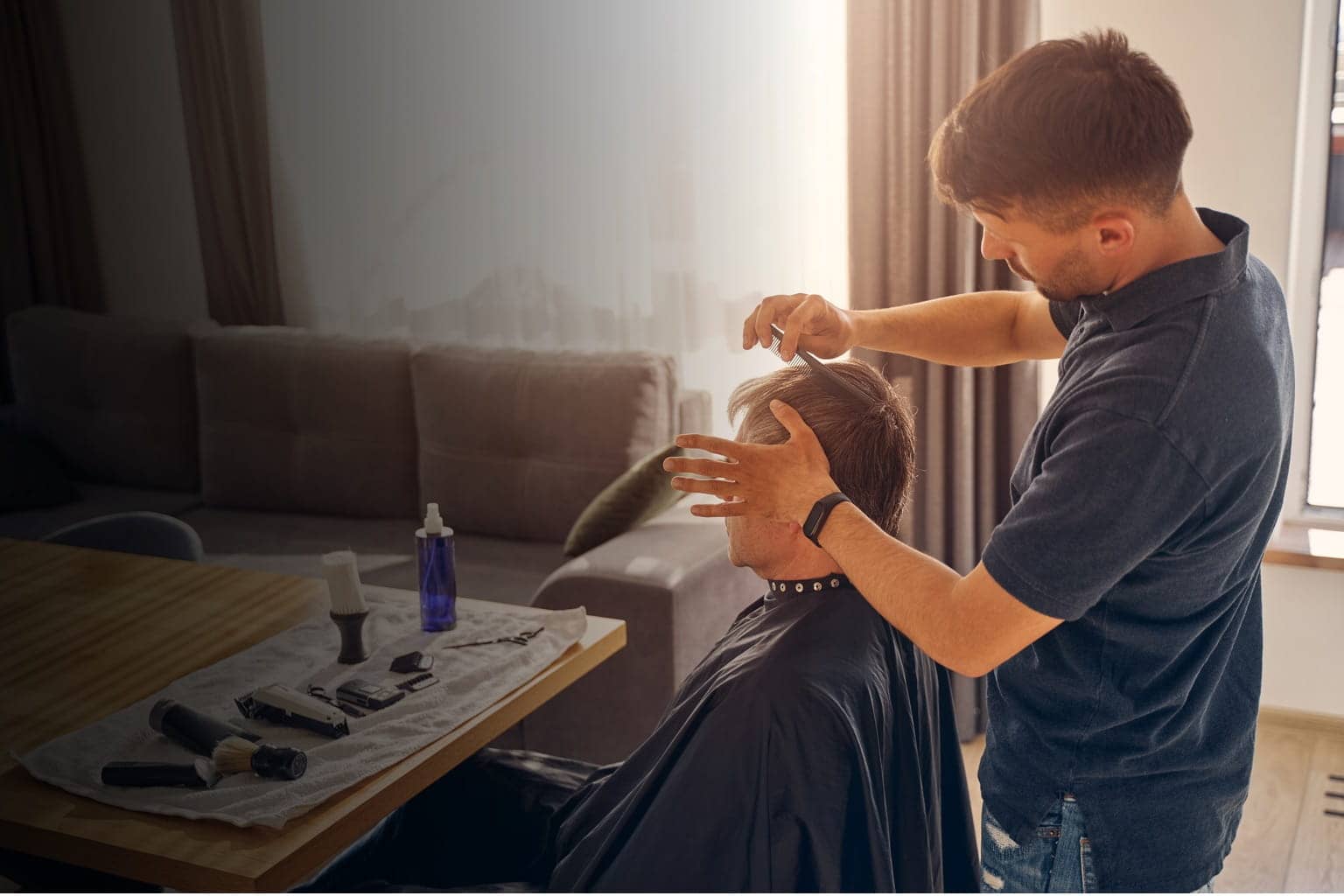 Mobile Barber styling a senior customer at home