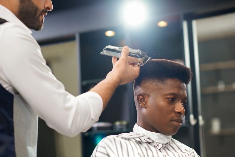 Barber with young customer